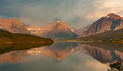 A photo of a gorgeous mountain and lake, intended as a representation of the nature of pleasure as tranquilly for Epicurus.