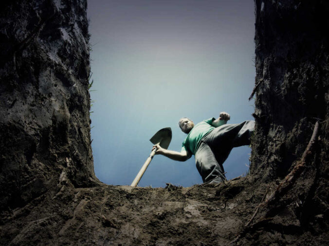 An image of the view from inside of a grave, looking up at the gravedigger. Intended to represent the fear of death as a part of a series on Epicureanism 101.