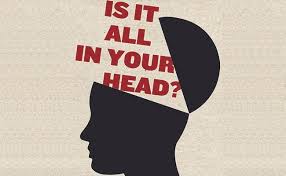 This is a photo of the cover of Suzanne O'Sullivan's book Is It All In Your Head? The cover depicts the title emerging from a shadow person's head.