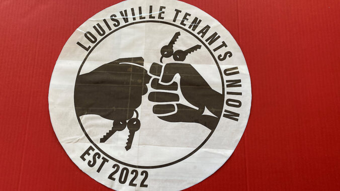 A banner for the Louisville Tenants Union, established 2022, with two hands pressed together holding apartment keys.